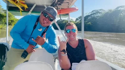 Kender Baltodano and a client on a boat on the Tempisque rive in Palo Verde National park